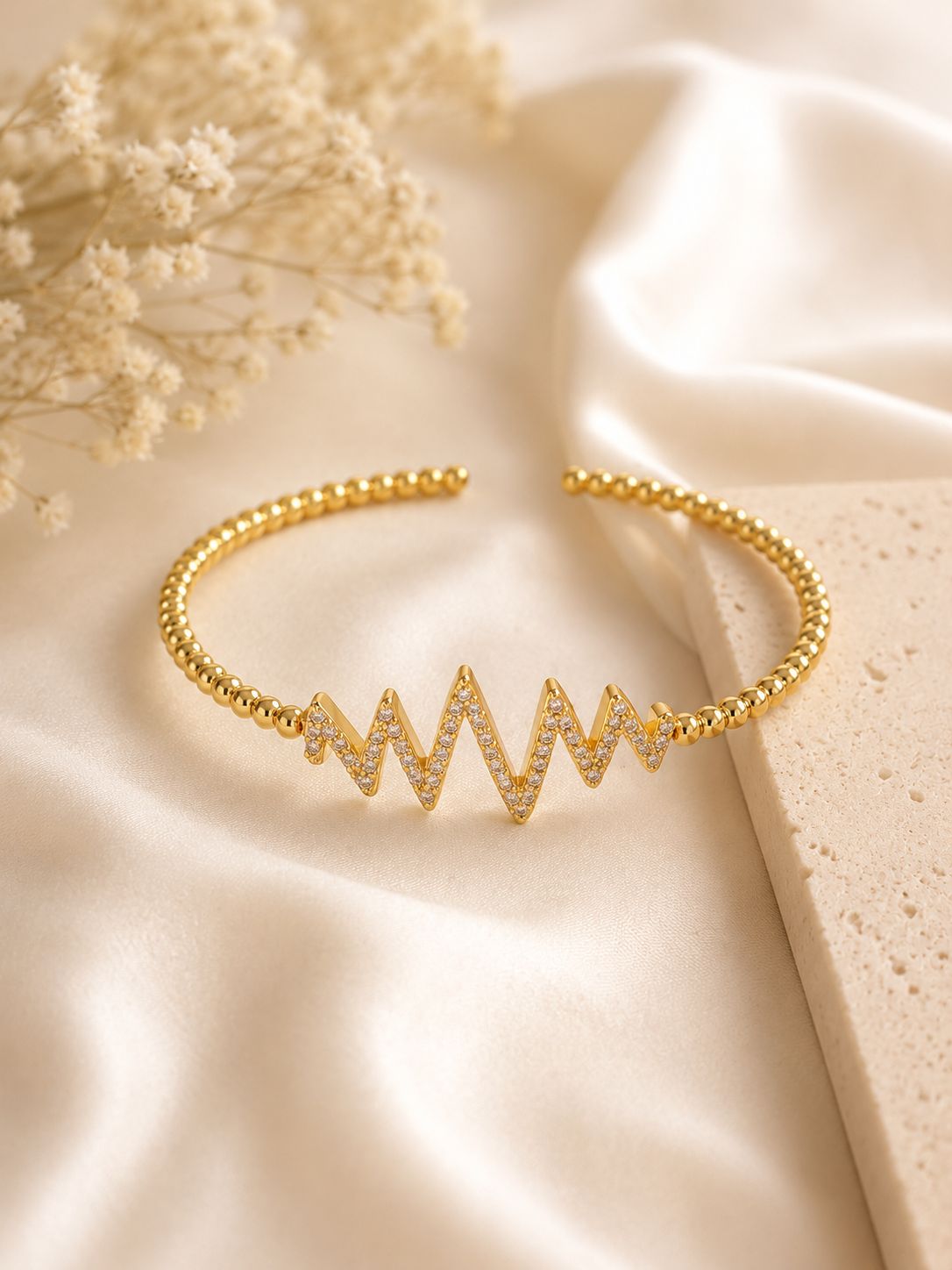 Elegant gold bangle with delicate accents